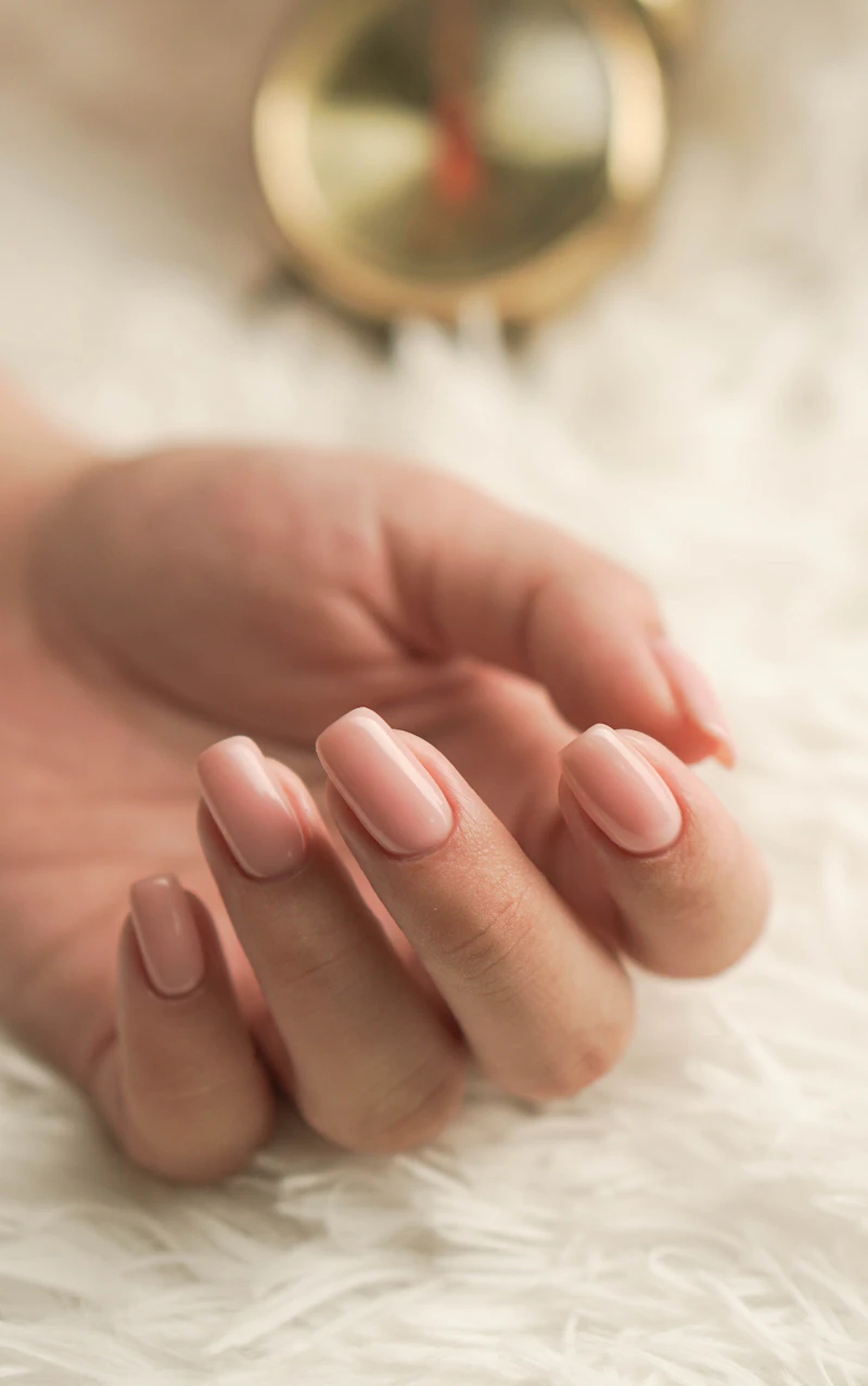 Soft pink manicured nails